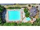 Aerial view of a community pool with lounge chairs and landscaped surroundings, perfect for relaxation at 7020 Grassmoor Grange Way, Cumming, GA 30040