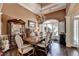 Formal dining room with chandelier, trey ceilings, hardwood floors, and large windows at 7020 Grassmoor Grange Way, Cumming, GA 30040