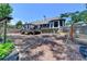 Expansive backyard with a deck, landscaping, swing set, and lush greenery, perfect for outdoor activities and relaxation at 7020 Grassmoor Grange Way, Cumming, GA 30040