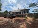 Home exterior with a deck and a stone walkway at 7020 Grassmoor Grange Way, Cumming, GA 30040