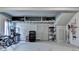 Spacious garage with storage shelving and ample room for vehicles at 7020 Grassmoor Grange Way, Cumming, GA 30040