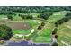 Scenic golf course view with lush greenery, sand traps, and a tranquil pond with a fountain feature at 7020 Grassmoor Grange Way, Cumming, GA 30040
