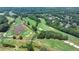 Scenic aerial view of a lush green golf course with mature trees and manicured grounds at 7020 Grassmoor Grange Way, Cumming, GA 30040