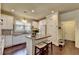 Modern kitchen featuring white cabinets, granite countertops, and stainless appliances at 7020 Grassmoor Grange Way, Cumming, GA 30040