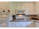 Modern kitchen with granite countertops, stainless steel appliances, and ample storage at 7020 Grassmoor Grange Way, Cumming, GA 30040