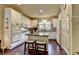 Bright kitchen featuring white cabinets, a pantry, and stainless steel appliances at 7020 Grassmoor Grange Way, Cumming, GA 30040