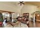 Living room features hardwood flooring, natural lighting, and dining area at 7020 Grassmoor Grange Way, Cumming, GA 30040