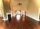 Bright living room features a fireplace and elegant wood floors at 7020 Grassmoor Grange Way, Cumming, GA 30040