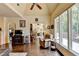 Bright living room with hardwood floors and comfortable seating overlooks the outdoor deck area at 7020 Grassmoor Grange Way, Cumming, GA 30040