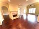 Spacious living room with a fireplace and hardwood flooring at 7020 Grassmoor Grange Way, Cumming, GA 30040
