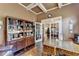 Bright home office showcasing custom shelves, French doors, and a sophisticated desk setup at 7020 Grassmoor Grange Way, Cumming, GA 30040