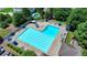 Aerial view of a large community pool with lounge chairs and umbrellas, perfect for relaxation and recreation at 7020 Grassmoor Grange Way, Cumming, GA 30040
