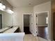 Bathroom with double granite sinks, a linen closet, and a separate room for toilet at 725 Valley Glen Dr, Dacula, GA 30019