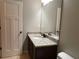 This bathroom boasts granite countertops, wood cabinets, and tile floors at 725 Valley Glen Dr, Dacula, GA 30019