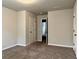 Neutral bedroom with large closet, and door to Primary bathroom at 725 Valley Glen Dr, Dacula, GA 30019