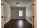 Spacious bedroom featuring dark hardwood floors and one window at 725 Valley Glen Dr, Dacula, GA 30019