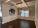 Elegant dining room features coffered ceilings, chair railing, and hardwood floors at 725 Valley Glen Dr, Dacula, GA 30019