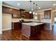 Beautiful kitchen featuring dark cabinets, stainless steel appliances and granite countertops at 725 Valley Glen Dr, Dacula, GA 30019