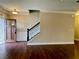 Inviting foyer features hardwood floors, staircase, and craftsman-style door at 725 Valley Glen Dr, Dacula, GA 30019