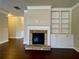 The living room has a stone fireplace and a built-in bookcase with cabinets at 725 Valley Glen Dr, Dacula, GA 30019