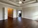 Spacious main bedroom featuring a tray ceiling and access to the bathroom at 725 Valley Glen Dr, Dacula, GA 30019