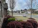 Quiet street view with sidewalks showcasing well-maintained lawns and traditional-style homes in a peaceful neighborhood setting at 725 Valley Glen Dr, Dacula, GA 30019