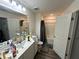 Bathroom with double sinks, neutral paint, and tub-shower combination with gray curtain at 136 Swindon Dr, Mcdonough, GA 30253