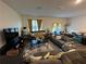 Spacious living room with ample seating and natural light at 136 Swindon Dr, Mcdonough, GA 30253
