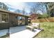 Backyard patio features a brick exterior, sliding glass doors, and an outdoor seating area perfect for entertaining guests at 2569 Woodhill Ln, Atlanta, GA 30344