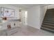 Bright basement featuring a modern bar area, staircase, and neutral colors creating a cozy, versatile space at 2569 Woodhill Ln, Atlanta, GA 30344