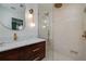 Modern bathroom features a walk-in shower, sleek vanity, and stylish gold fixtures at 2569 Woodhill Ln, Atlanta, GA 30344