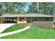 Beautiful home featuring fresh landscaping, a welcoming entrance, and ample parking at 2569 Woodhill Ln, Atlanta, GA 30344