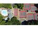 An aerial view showcasing the community amenities including multiple tennis courts and swimming pool at 3902 Butterstream Nw Way, Kennesaw, GA 30144
