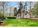 Expansive backyard featuring lush green grass, mature trees, a charming fence, and a swing set at 3902 Butterstream Nw Way, Kennesaw, GA 30144