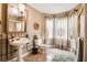 Elegant bathroom with a pedestal sink, unique tile floors, and decorative window treatments at 3902 Butterstream Nw Way, Kennesaw, GA 30144