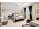 Tranquil bedroom featuring a decorative bed frame, neutral walls, and natural light from the windows at 3902 Butterstream Nw Way, Kennesaw, GA 30144