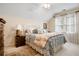 Comfortable bedroom with a large bed, soft natural light, and neutral colors at 3902 Butterstream Nw Way, Kennesaw, GA 30144