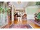 Inviting foyer with hardwood floors, elegant rug, and decorative wreath on the stained-glass front door at 3902 Butterstream Nw Way, Kennesaw, GA 30144