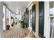Inviting front porch with hanging plants, a vintage bench, and dark shutters at 3902 Butterstream Nw Way, Kennesaw, GA 30144