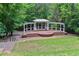 Gazebo surrounded by lush greenery and mature trees, creating a serene and inviting space at 3902 Butterstream Nw Way, Kennesaw, GA 30144