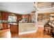 Open kitchen with wood cabinets, granite countertops, stainless appliances and hardwood floors at 3902 Butterstream Nw Way, Kennesaw, GA 30144