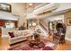 Spacious living room with high ceilings, comfortable seating and a staircase with Gathering photos at 3902 Butterstream Nw Way, Kennesaw, GA 30144