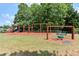 Community playground with swings, play structures, and picnic tables on a sunny day at 3902 Butterstream Nw Way, Kennesaw, GA 30144