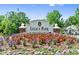 Beautiful entrance sign for Legacy Park with colorful flowers in the foreground at 3902 Butterstream Nw Way, Kennesaw, GA 30144