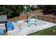 A fenced in splash pad featuring a palm tree water feature and shark-themed figures at 3902 Butterstream Nw Way, Kennesaw, GA 30144