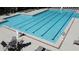 A large swimming pool with marked lanes, lounge chairs, and tables nearby at 3902 Butterstream Nw Way, Kennesaw, GA 30144