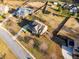Expansive aerial view of a suburban home featuring a large yard, mature trees, and neighboring houses at 4535 Meadow Green Ln, Acworth, GA 30101