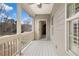 View of back porch with ceiling fan and view of backyard at 4535 Meadow Green Ln, Acworth, GA 30101