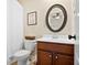 Cozy bathroom with white shower curtain and oval mirror at 4535 Meadow Green Ln, Acworth, GA 30101
