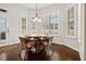 Bright breakfast nook with large windows, a round table, and wicker chairs at 4535 Meadow Green Ln, Acworth, GA 30101